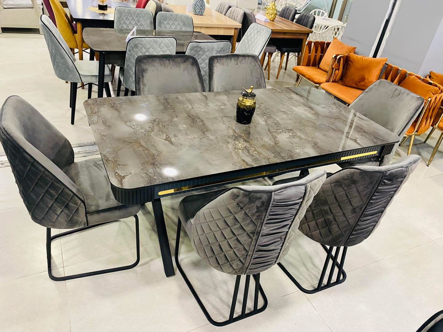 Stone-Top Dining Table with Quilted Velvet Chairs